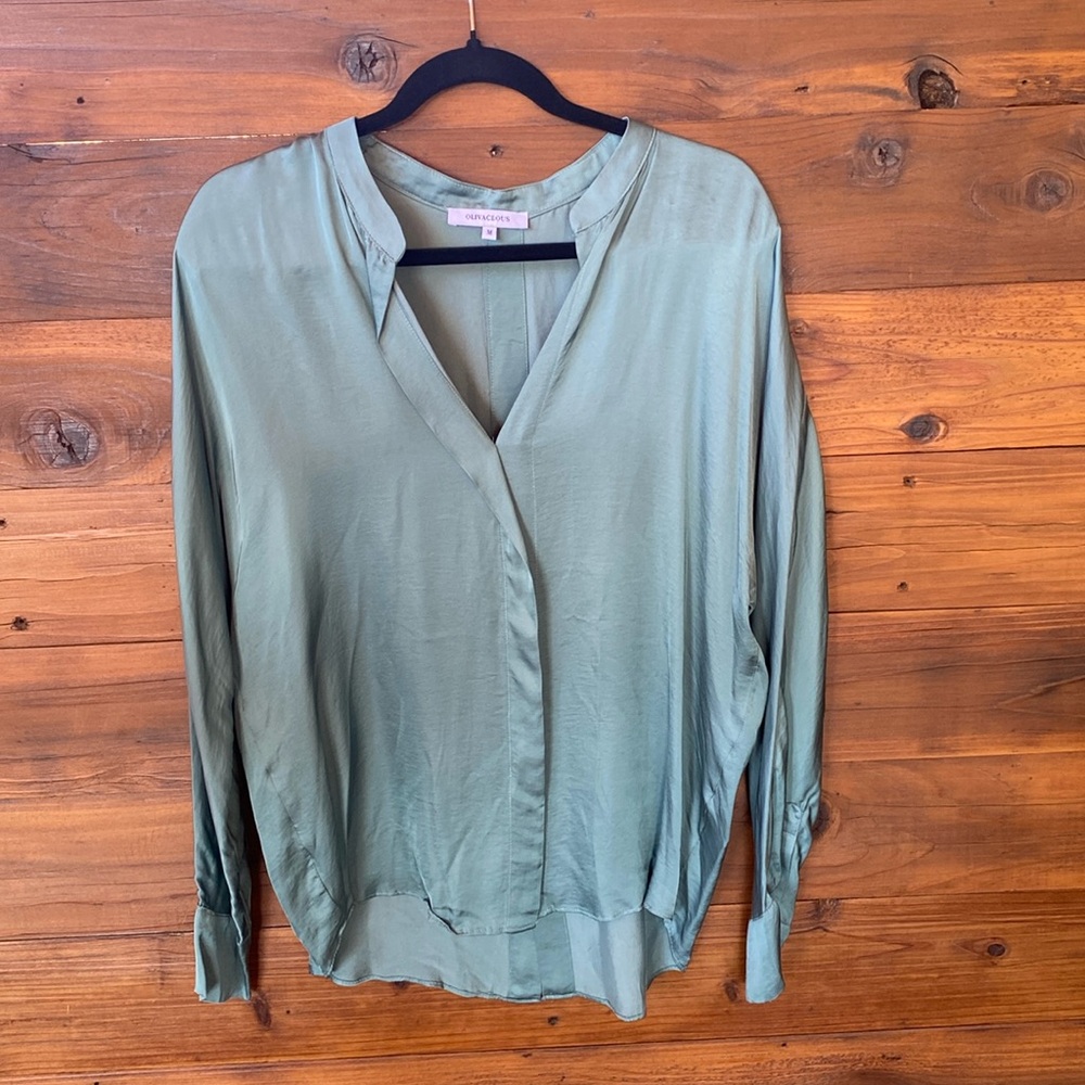 Light green/teal silky blouse.